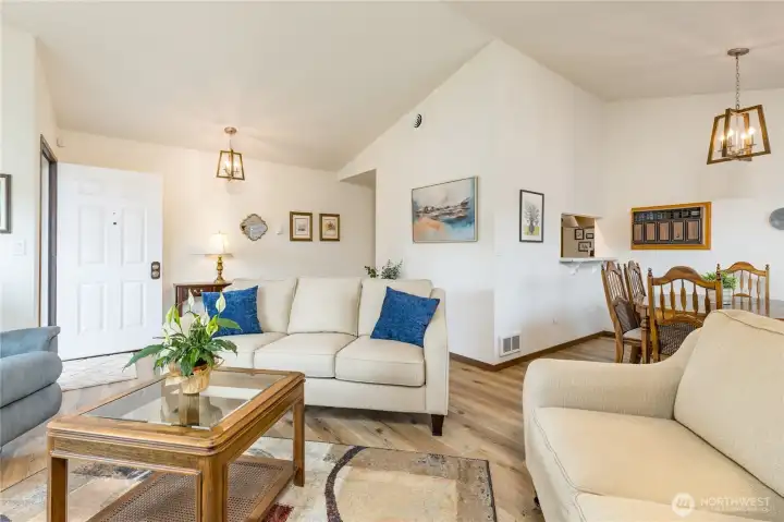 Living room flows to the formal dining room.