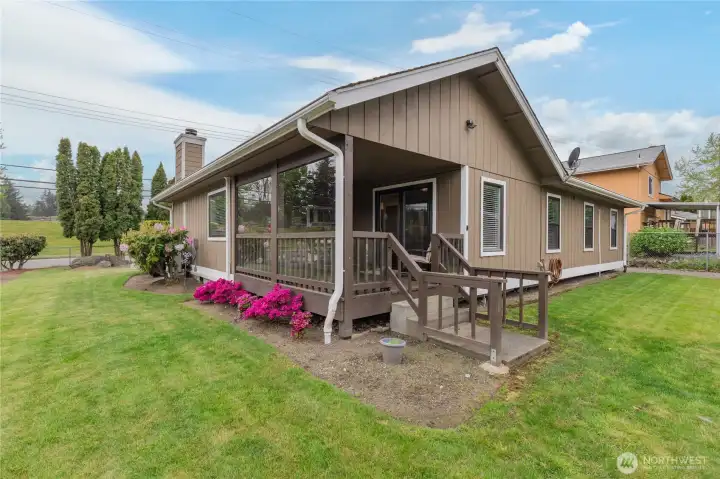 Seamless transition from the covered deck to your level, fully-fenced backyard—perfect for pets, gardening, or outdoor play!