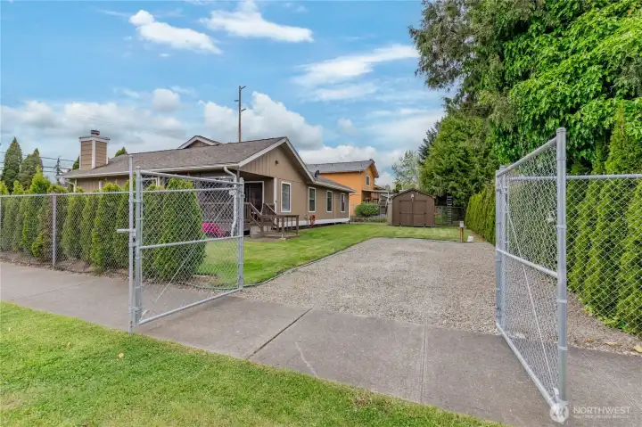 Rare North End find! Secure, gated RV parking with a dedicated gravel pad and wide gate for easy maneuvering.