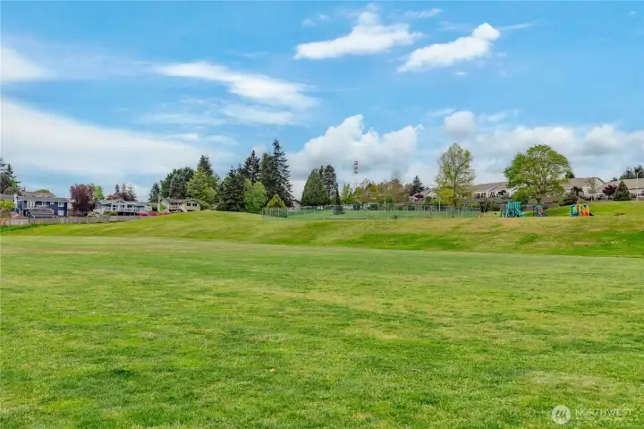 Your extended front yard! Enjoy the playground and open green space of the neighborhood park located directly across the street.