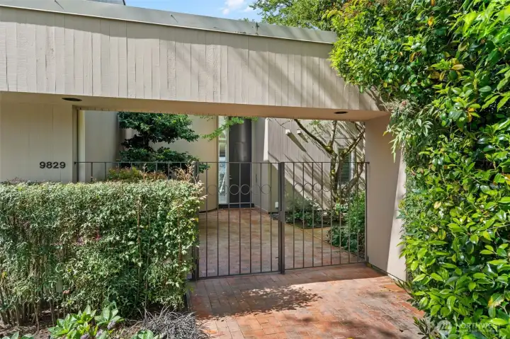 A private iron gate and brick courtyard set the tone the moment you arrive — this is a home that greets you differently than the rest. The walled entry garden creates a seamless transition between the street and the sanctuary within, offering a level of privacy rarely found at this price point in Bellevue. First impressions here are earned, not accidental.