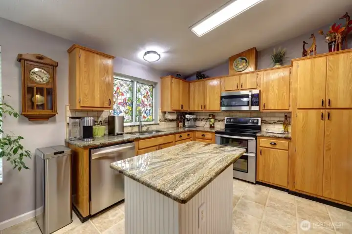 Granite topped center island is great workspace