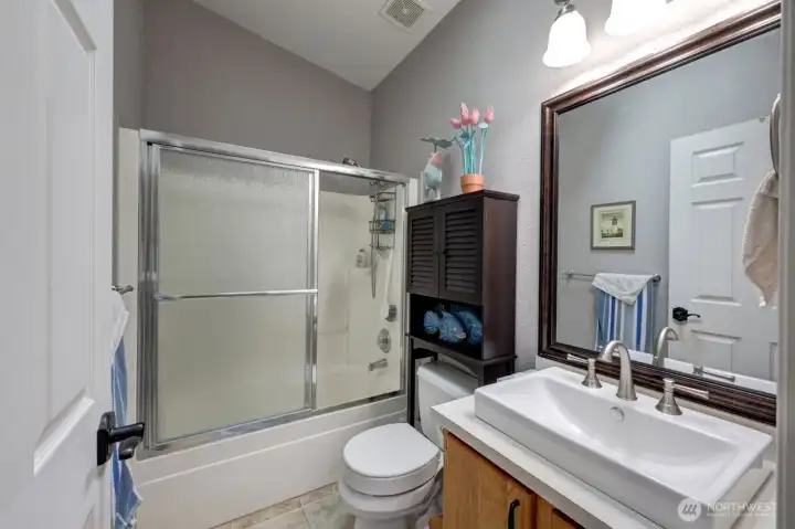 Main bathroom has a tub/shower combo
