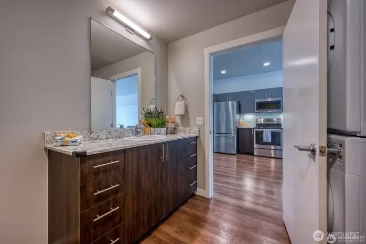 Functional design with adjacent kitchen, bath, and laundry Functional design with adjacent kitchen, bath, and laundry