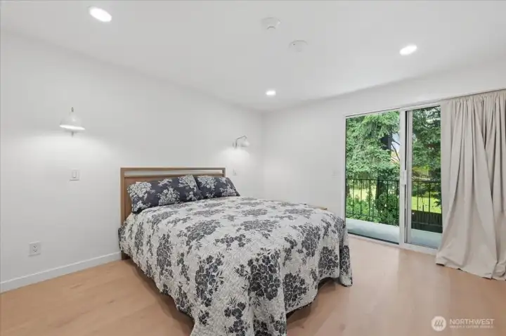 Primary Bedroom w/balcony.