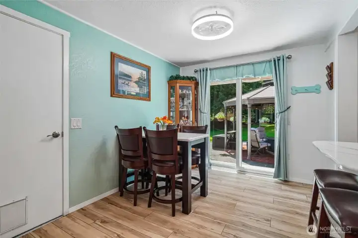 Lovely dining room that leads to back yard oasis, yard to garage and washer/dryer.