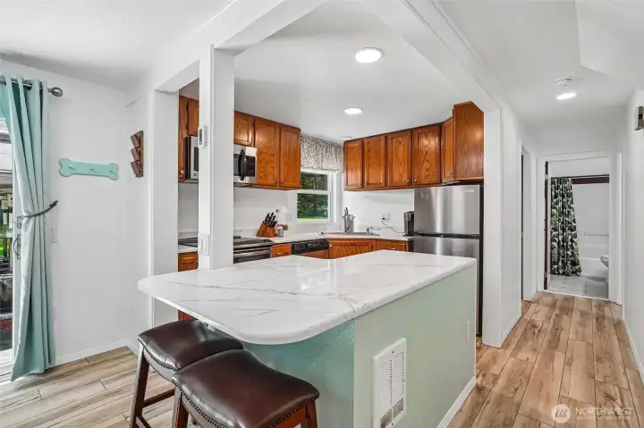 Quartz countertops and breakfast bar.