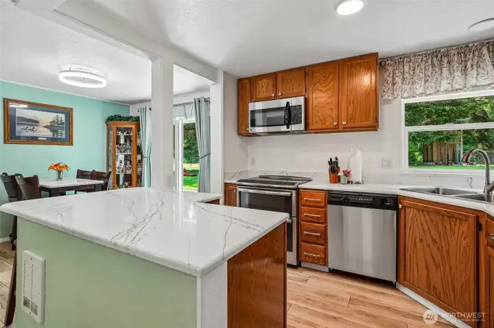 Stainless steel appliances, oak cabinetry