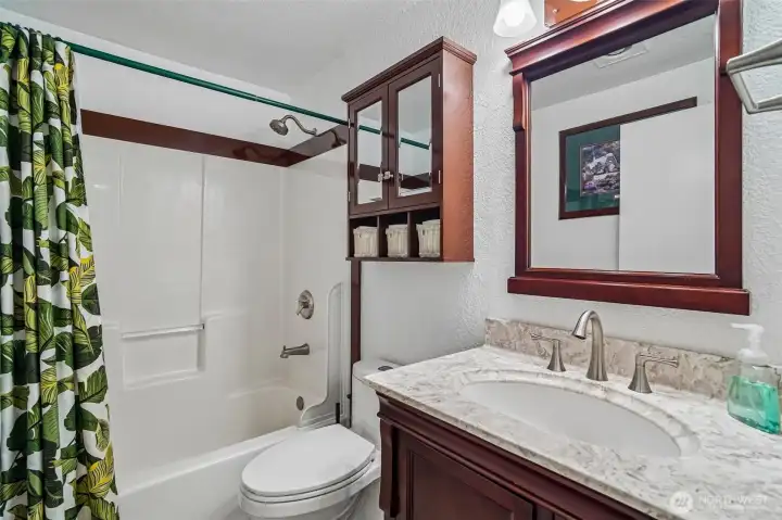 Full bath with quartz countertops