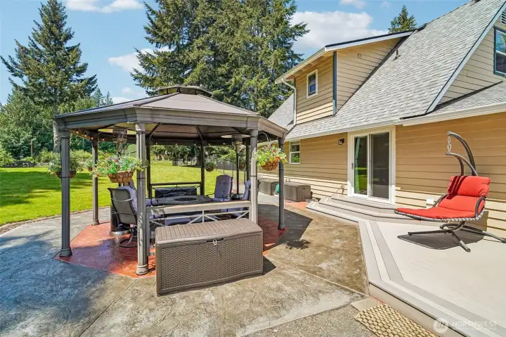 A beautiful stamped concrete patio with a large gazebo ideal for year round living.
