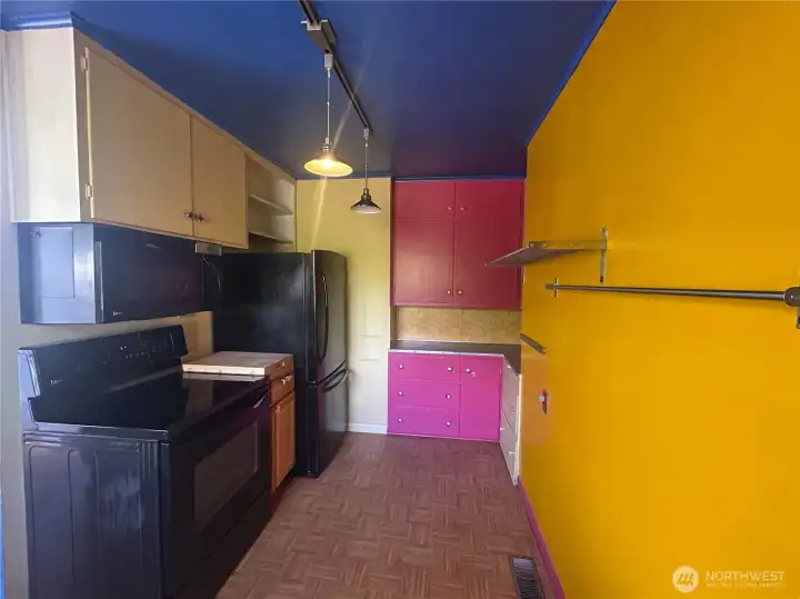 Another view of the expansive kitchen with storage galore!