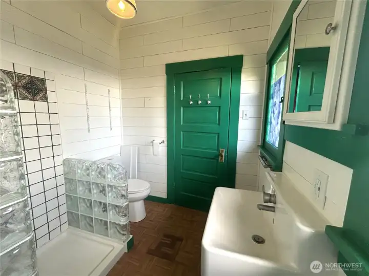 Bathroom with fabulous natural light, and bidet feature installed to toilet.