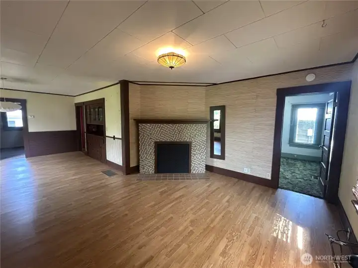 Great room style living space. Well sized living room with wood burning fireplace and mantle.