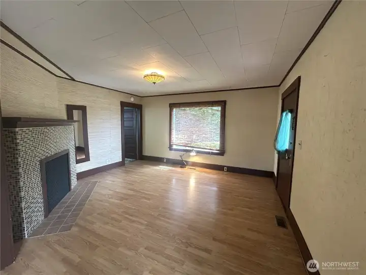 Living room also boasts large windows for plenty of natural light.