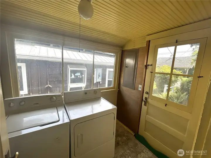 Laundry/utility room off kitchen. Hot water heater to the left.