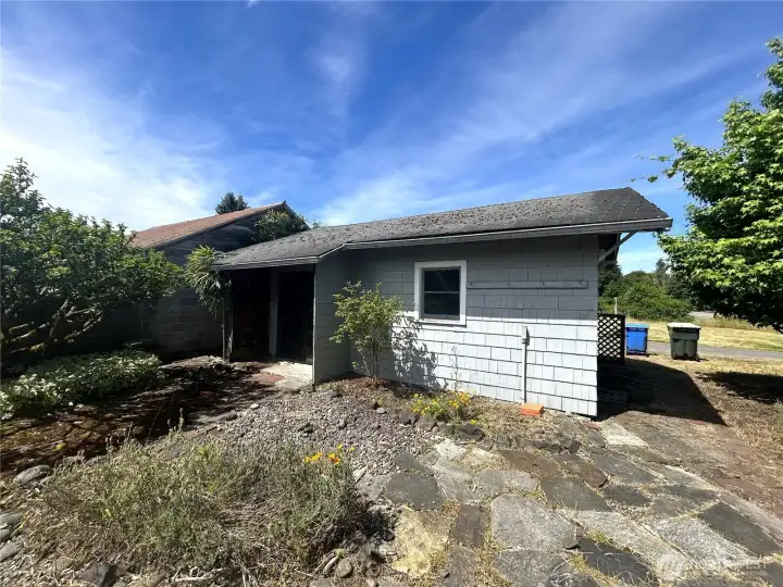 Detached garage has been converted to additional space.