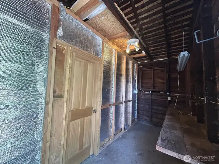 Shop or garden storage space included in garage.