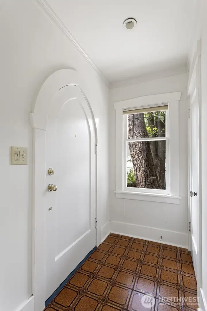 Freshly painted interior with original tile in the entry.