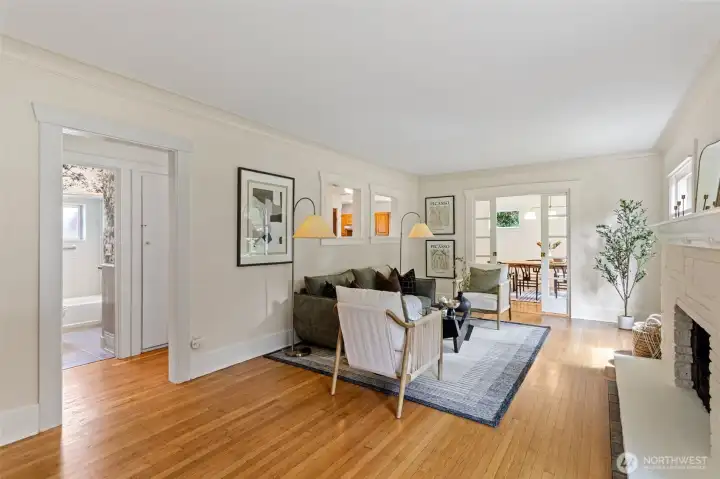 Spacious living room with freshly refinished original oak hardwood floors.