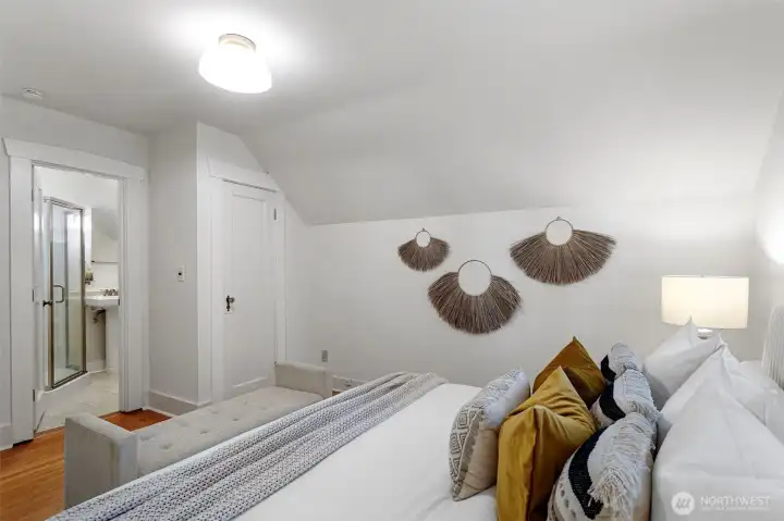 Primary bedroom with en-suite 3/4 bath and two separate closets.