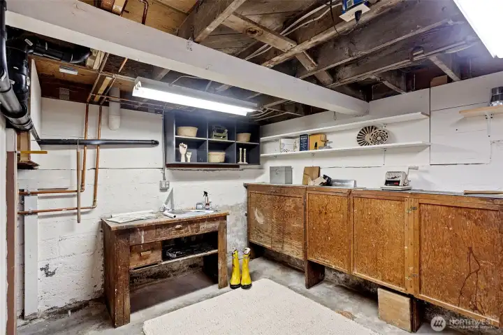 Workbench and storage space in the basement.