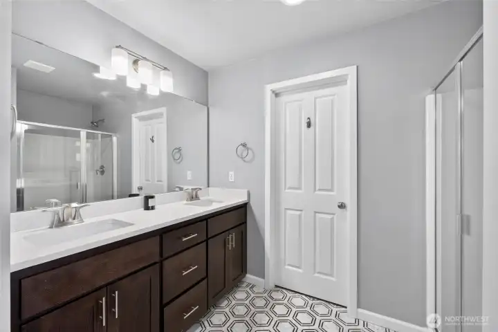5 piece primary bath with tile flooring. 5 piece primary bath with tile flooring.