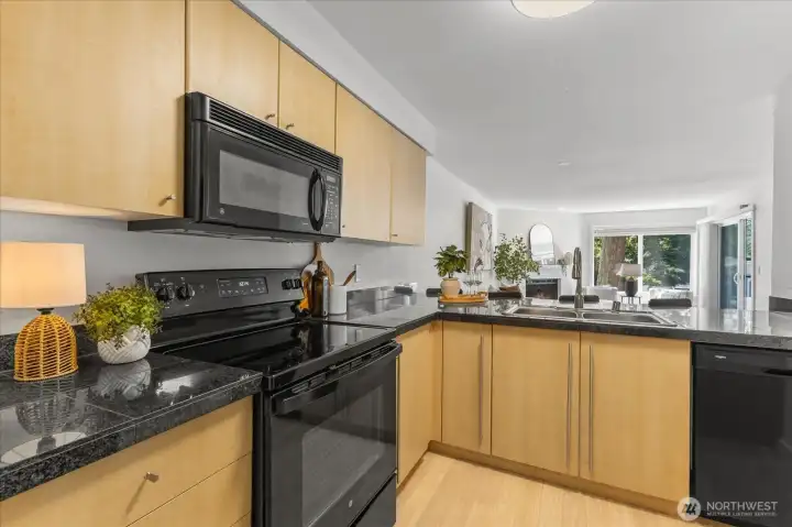 Boasting stylish black granite tiles for plenty of prep space. Boasting stylish black granite tiles for plenty of prep space.