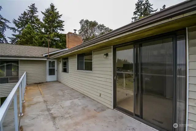 Large view deck with a metal & pane glass railing, and plenty of room for entertaining and BBQing.