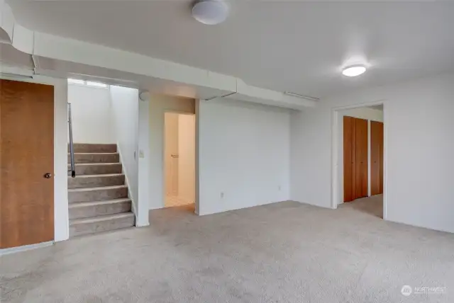 Stairs down to the lower level and the Family Room area.