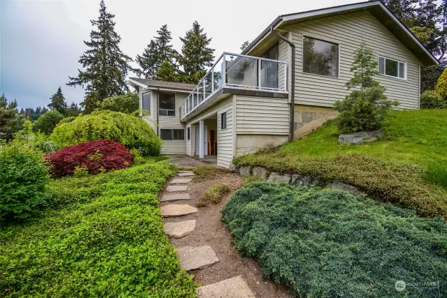 View of the lower level back yard and patio. Easy maintenance landscaping.