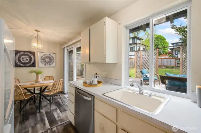 Lovely eating space and sliders that extend the flow of your living space and invite you to enjoy this amazing backyard!