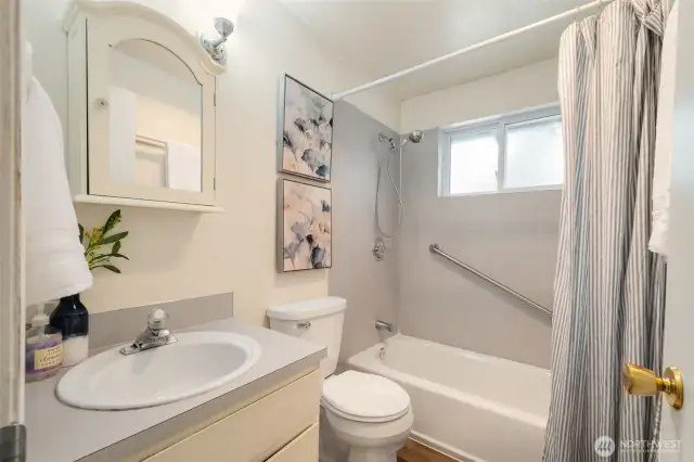 A bathroom with a tub and shower on the main floor + a bathroom on the 2nd level with a shower - how convenient is that?