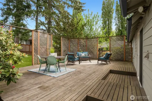 Just in time for summer!!!  What a lovely, private, and large deck through sliding doors off of your living space!