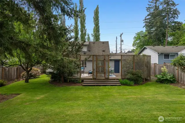 Beyond the perfect entertaing deck is this deep, fully-fenced backyard - room for sport or play of all sorts, for fiddo, for veggie gardens, of even a entire fruit orchard!  Or just enjoy the lush, green, shady space...