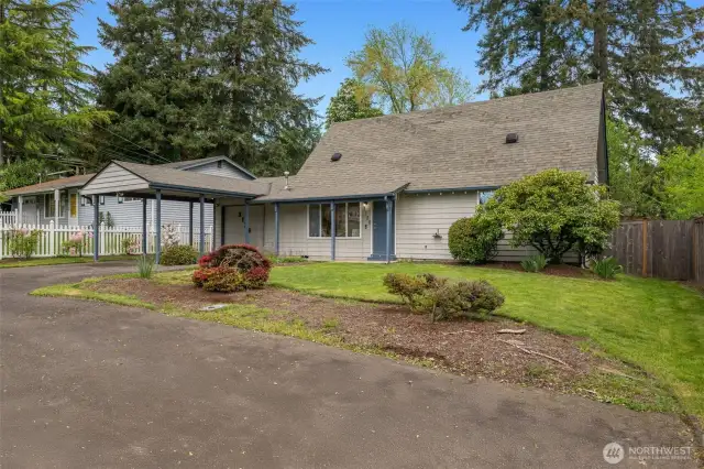 Lush green location, sweet neighborhood nook, a garage + carport + mutliple off-street parking spots.
