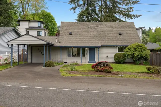 Lush green location, sweet neighborhood nook, a garage + carport + mutliple off-street parking spots.