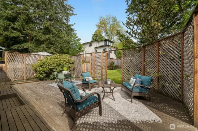 Just in time for summer!!!  What a lovely, private, and large deck through sliding doors off of your living space!
