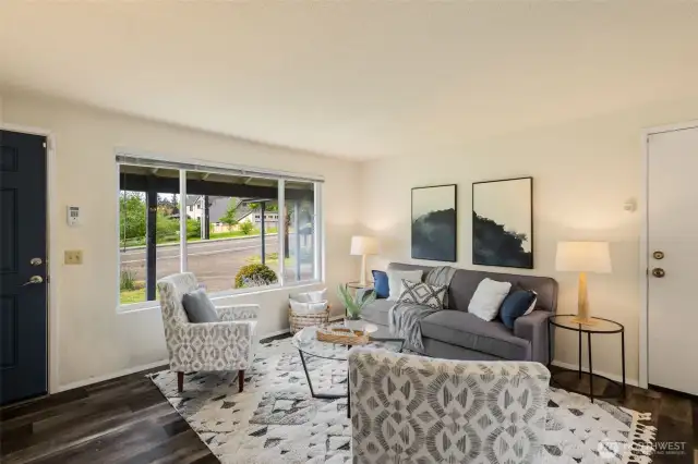 Charming great room with living-dining-kitchen spaces.  South-facing with big windows to the south and north to capture lovely natural light.