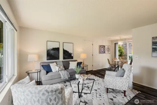 Charming great room with living-dining-kitchen spaces.  South-facing with big windows to the south and north to capture lovely natural light.