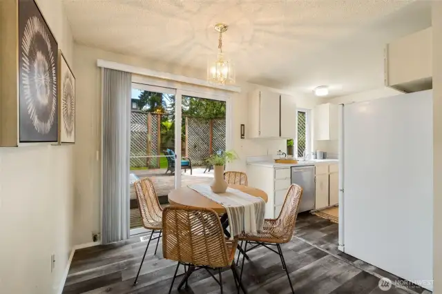 Lovely eating space and sliders that extend the flow of your living space and invite you to enjoy this amazing backyard!