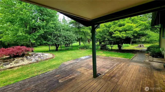 View from covered deck of the rear yard