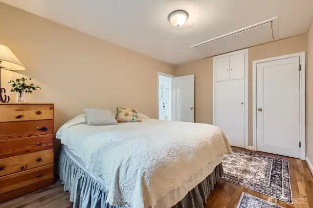 This shot shows the two separate closets and access to the attic.