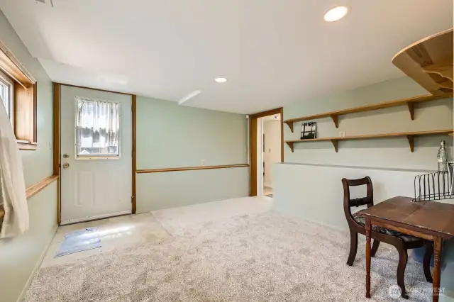 This room downstairs makes a terrific office! Storage and shelving, with a separate entry door for privacy. Brand new carpet and paint, too!