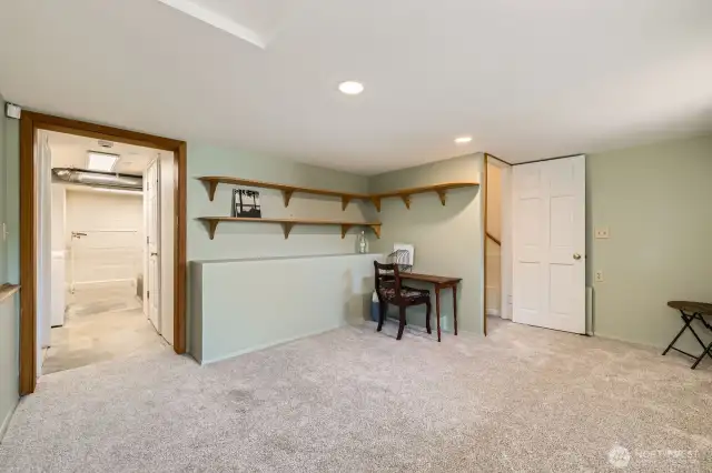 Downstairs office. Doorway on the left leads to large laundry room and storage area (Costco Room or natural wine cellar, perhaps?)