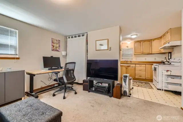 This is the ADU with separate entrance, one bedroom, one bath, washer/dryer, and it's own private patio space. This photo shows the living room and a bit of the kitchen. 528 square feet with terrific layout lives large. There is no photo of the bedroom in this unit, as the tenant was using it at the time. Floorplan will show the dimensions and layout of the bedroom. Plus, the Matterport tour includes the ADU bedroom, as well.