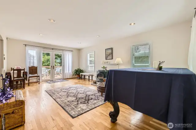 This spacious area can also be used as a living/dining room combo. French doors take you to the extra large entertaining deck for seamless indoor/outdoor living.