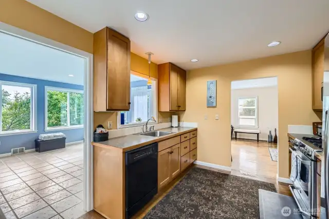 Plenty of storage and prep space in this centrally located kitchen. Newer cabinets and stainless stove and fridge. Beautiful hardwood floors, too!
