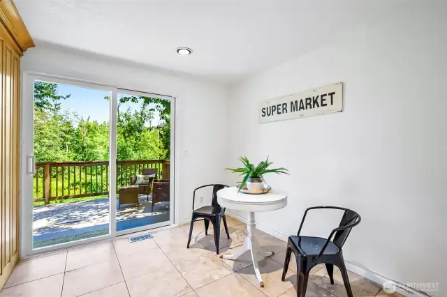 Spacious Eat*In Kitchen Overlooks the Upper Level Patio & Back Yard~Recently Installed Sliding Glass Door