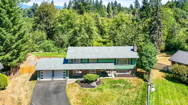 Recently Installed New Roof & Gutter System~Quality Build Mid*Entry Home~Real Wood & Real Brick~Covered Breezy Way from Garage to Home~RV~Boat~Trailer & Toys Parking on Either Side of the Double Gate~