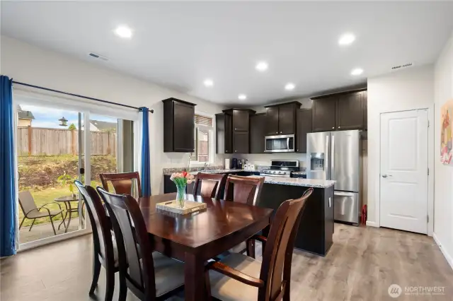 Dining area, stunning Dark brown cabinets, and generous granite countertops as well as an island!